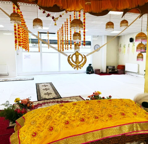 Prayer, kirtan, and langar in a Sikh gurdwara setting